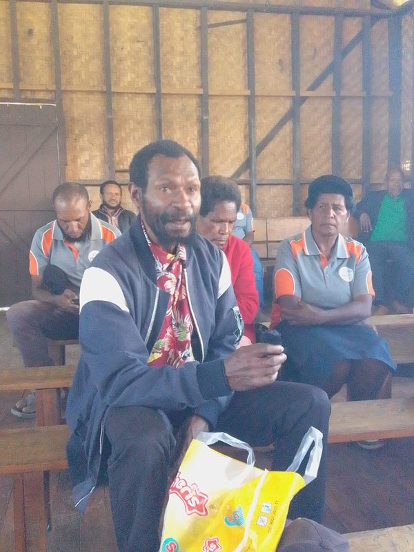 A review meeting with facilitators and church leadership after the seven week rollout. Gutnius Lutheran Church, Enga. August 2026.