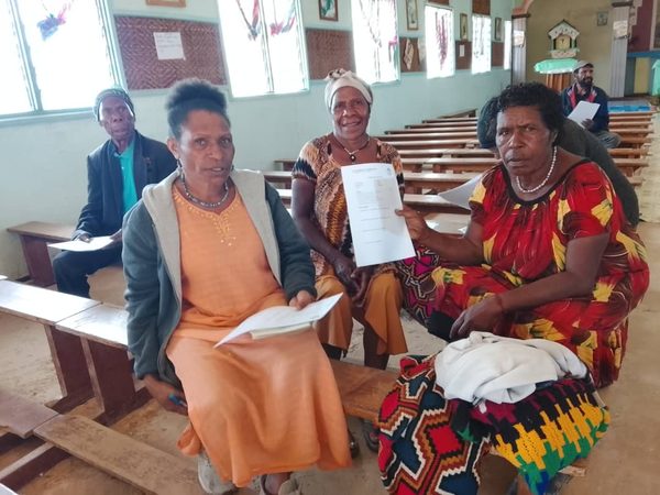 Participants completing endline surveys and program evaluation forms in the final week. Catholic Diocese of Mendi, Tigiri and Koya, Lower Mendi LLG, Southern Highlands. August 2026.