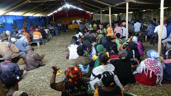 Graduates, families and community leaders under the shelter at the graduation. Catholic Diocese of Mendi, Lower Mendi Parish Centre, Tepe, Southern Highlands. September 2026.
